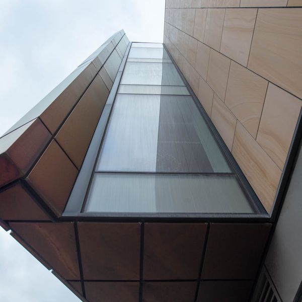 Person meditating in a bright room with natural light.